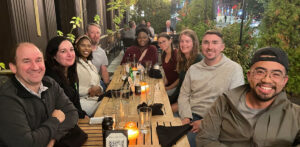 A group of people having dinner together at a Chicago restaurant.