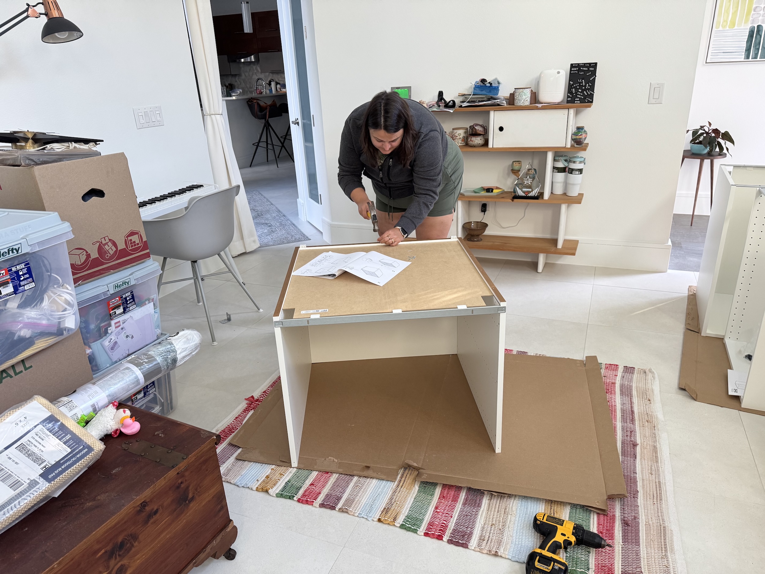 Photo of Amy building a base cabinet.